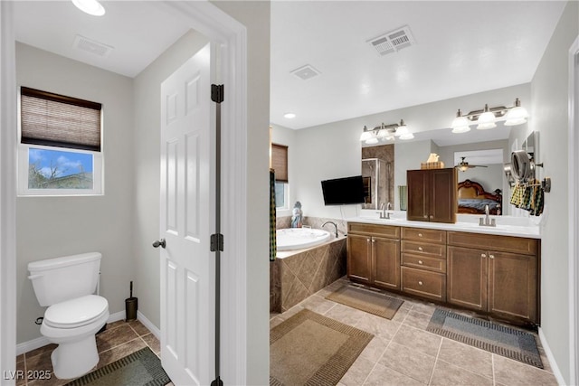 full bathroom with visible vents, a garden tub, a healthy amount of sunlight, and a shower stall