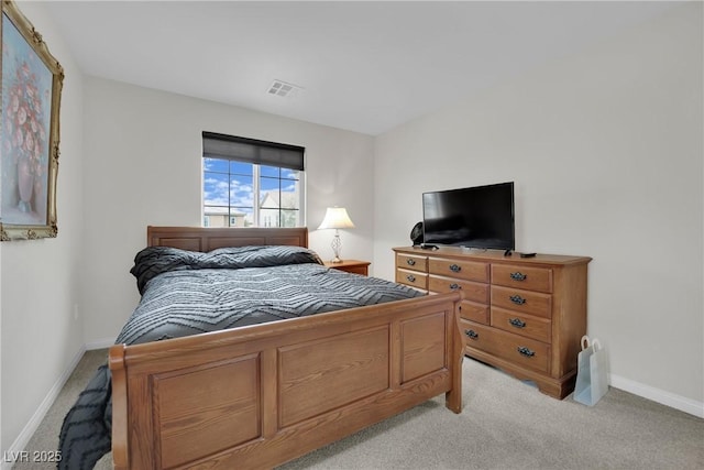 bedroom with light colored carpet, visible vents, and baseboards