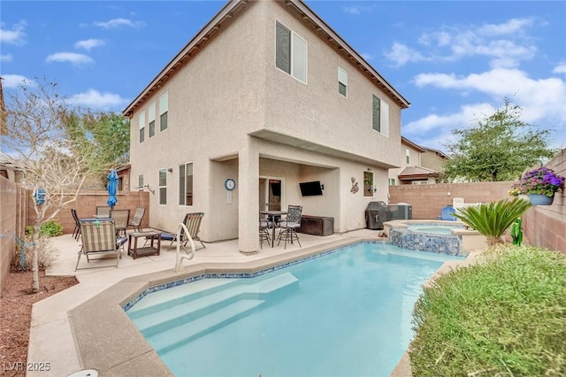 back of house featuring outdoor dining space, a patio, and stucco siding