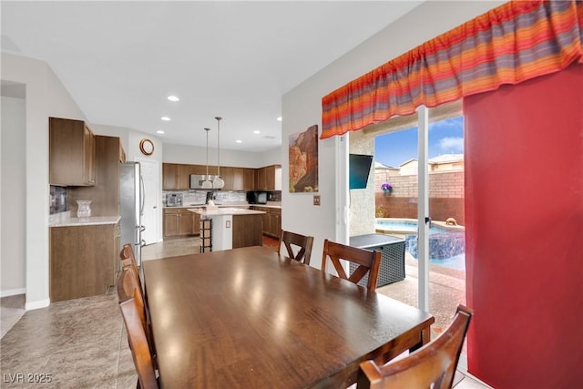 dining room featuring recessed lighting