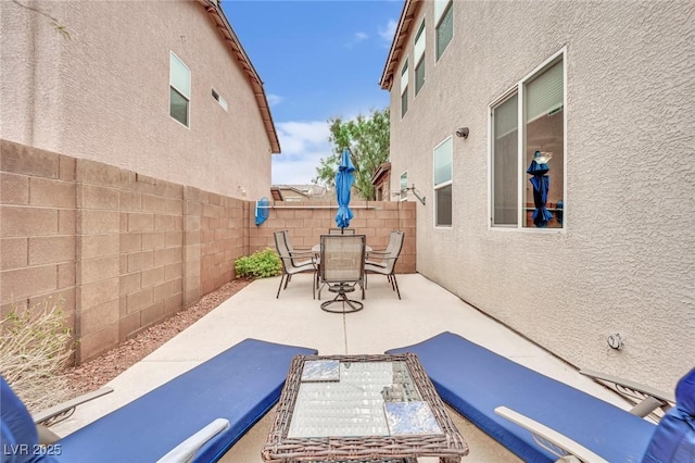 view of patio / terrace featuring outdoor dining area and a fenced backyard