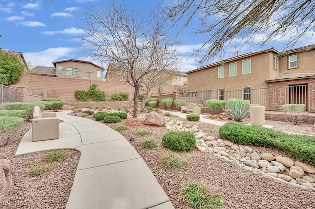 surrounding community with a patio and fence