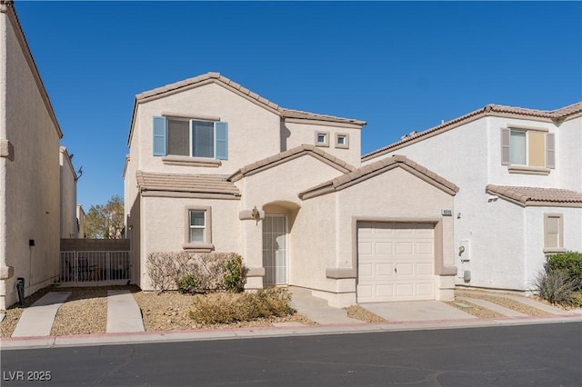 view of front of property featuring stucco siding and a tiled roof