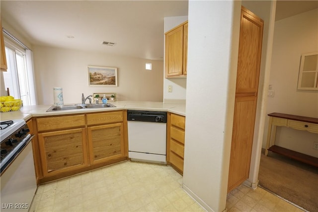 kitchen with visible vents, light floors, light countertops, white appliances, and a sink