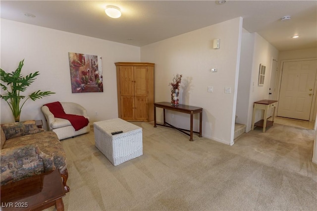 sitting room with light carpet and baseboards