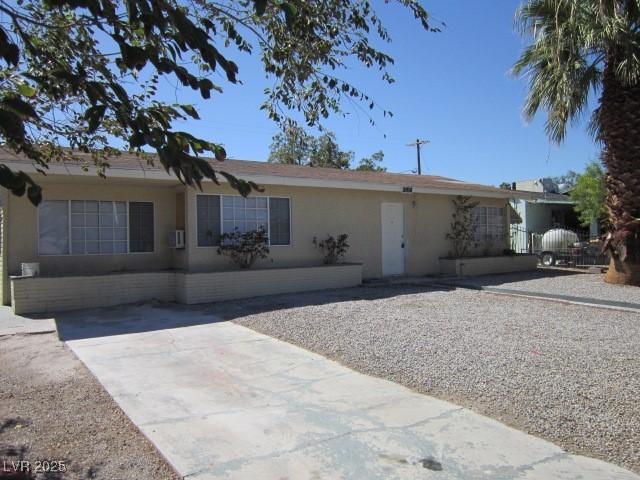 single story home featuring stucco siding