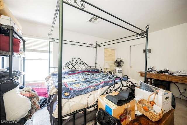 carpeted bedroom with visible vents