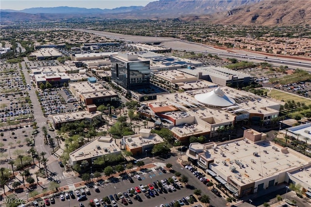 birds eye view of property featuring a mountain view