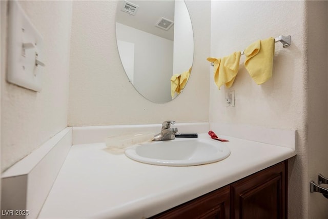 bathroom with visible vents and vanity