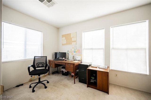 home office with visible vents and light colored carpet