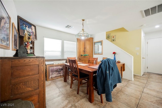 dining room with light tile patterned floors and visible vents