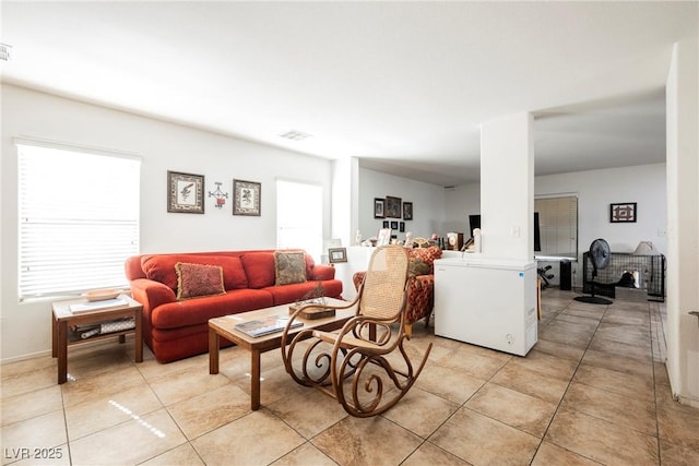 living area featuring light tile patterned flooring