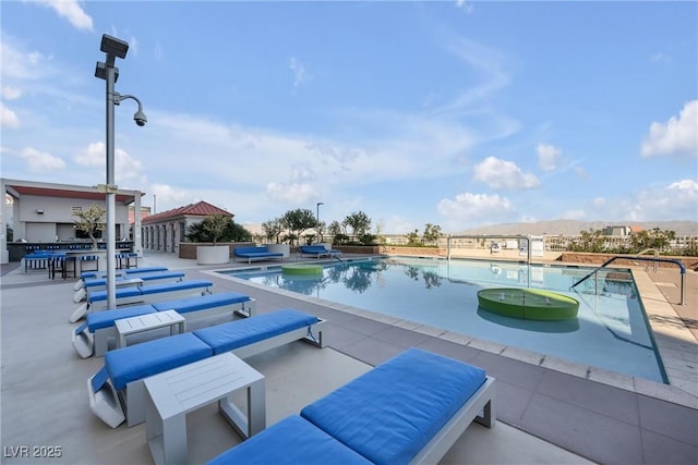 pool featuring a patio area