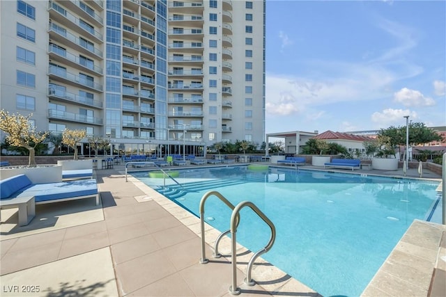 community pool featuring a patio area