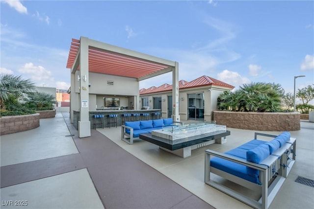 view of patio / terrace with outdoor dry bar and an outdoor hangout area