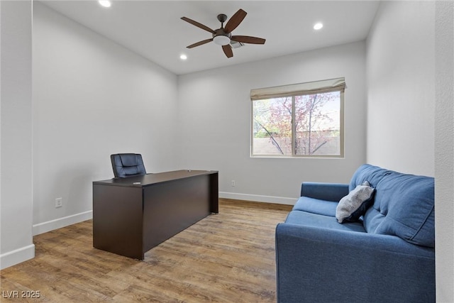 home office with a ceiling fan, recessed lighting, light wood-type flooring, and baseboards