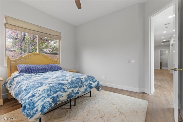 bedroom with recessed lighting, wood finished floors, baseboards, and ceiling fan