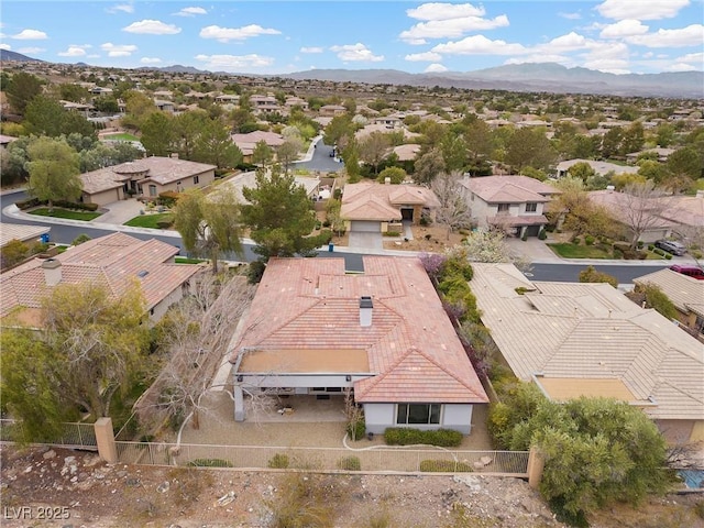 drone / aerial view with a residential view and a mountain view