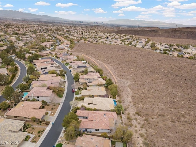 birds eye view of property with a residential view and a mountain view