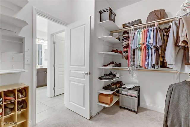 walk in closet featuring carpet