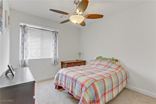 bedroom with light carpet, a ceiling fan, and baseboards