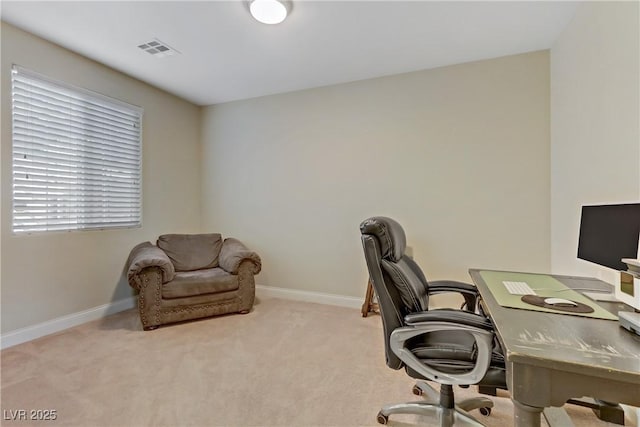 office area featuring visible vents, baseboards, and carpet floors