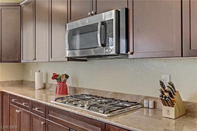 kitchen featuring appliances with stainless steel finishes and light countertops