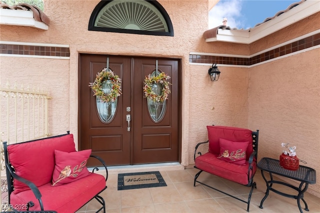 property entrance featuring stucco siding