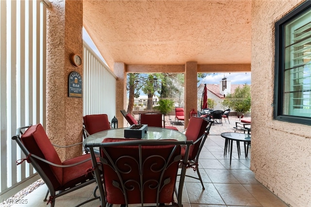 view of patio featuring outdoor dining area