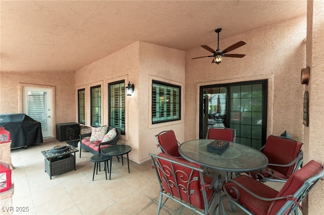 view of patio / terrace with area for grilling, outdoor dining area, and ceiling fan