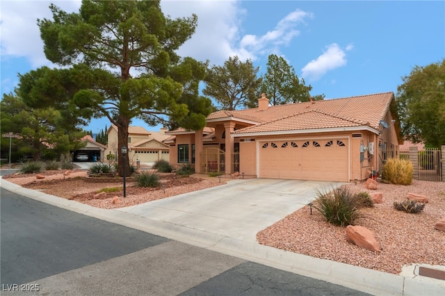 view of front of house featuring fence, an attached garage, stucco siding, a chimney, and a tiled roof