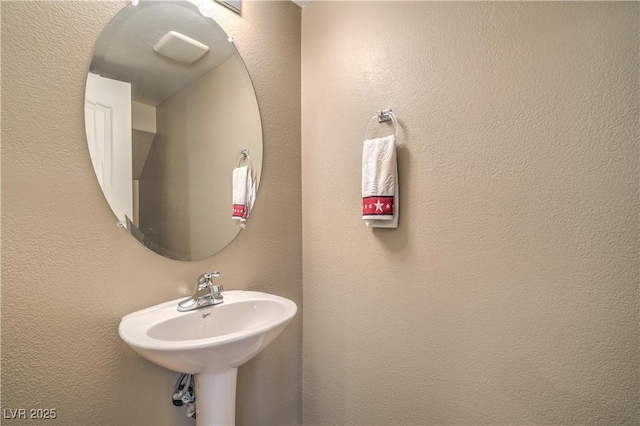 bathroom with a textured wall