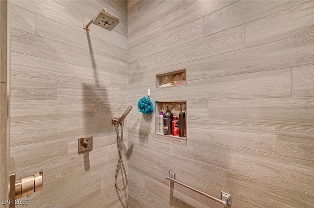 bathroom with tiled shower