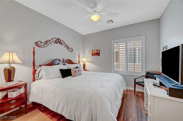 bedroom with ceiling fan, dark wood-style floors, visible vents, and baseboards