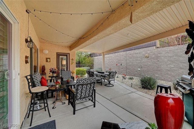 view of patio featuring outdoor dining area