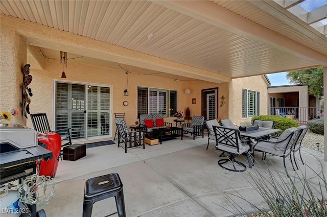 view of patio / terrace featuring outdoor dining space and an outdoor living space