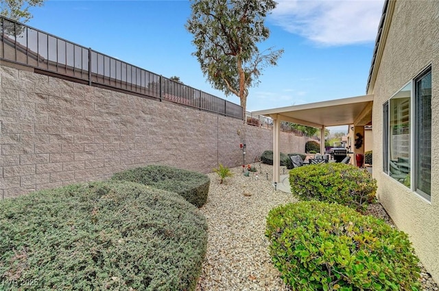 view of yard with a patio area and a fenced backyard