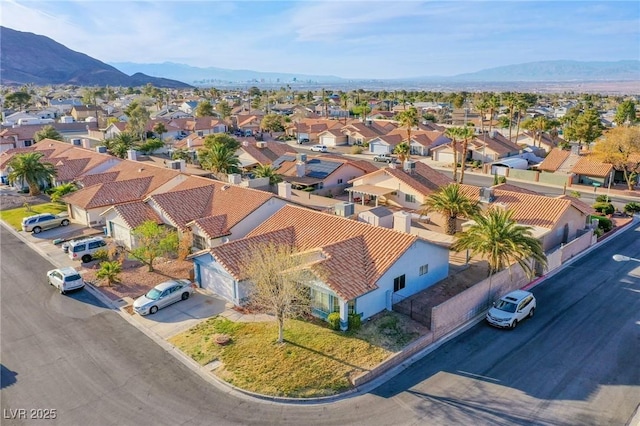 birds eye view of property with a residential view and a mountain view