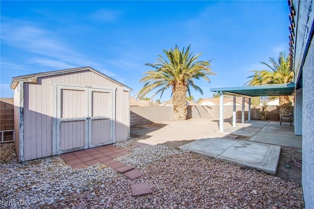 view of shed with a fenced backyard