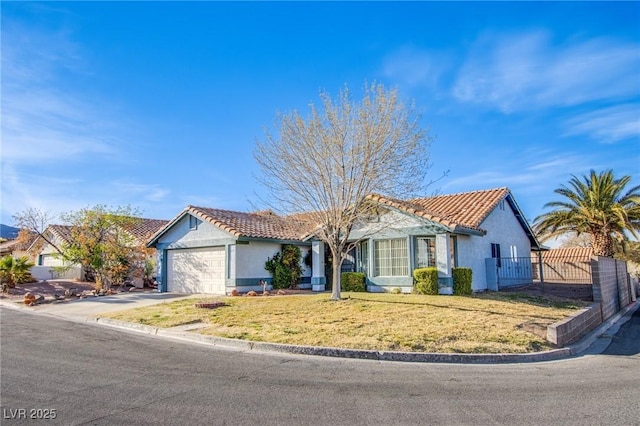 ranch-style house featuring fence, stucco siding, a front lawn, concrete driveway, and a garage