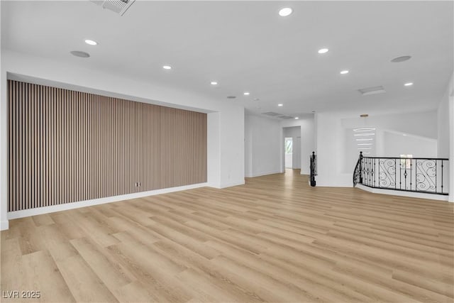 spare room featuring visible vents, recessed lighting, and light wood-type flooring