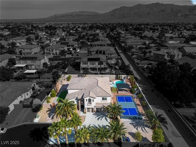 aerial view featuring a mountain view and a residential view