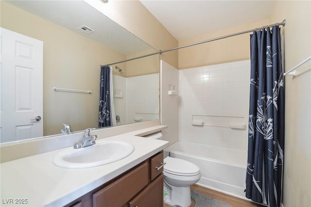 full bath featuring vanity, wood finished floors, visible vents, toilet, and shower / tub combo with curtain