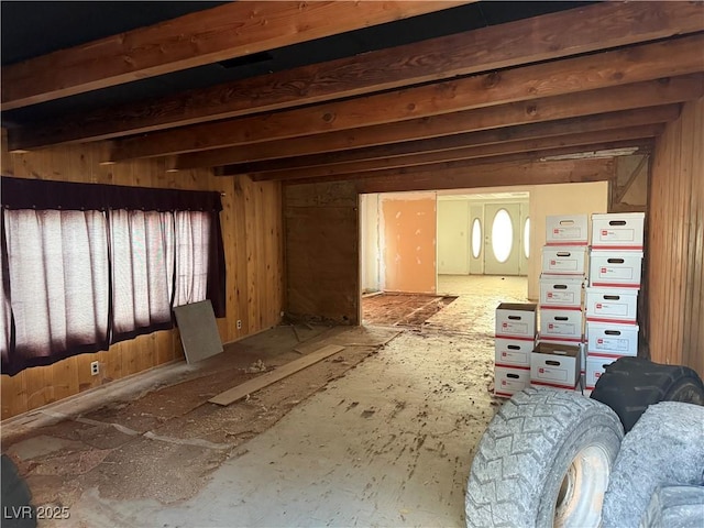 living area featuring beamed ceiling