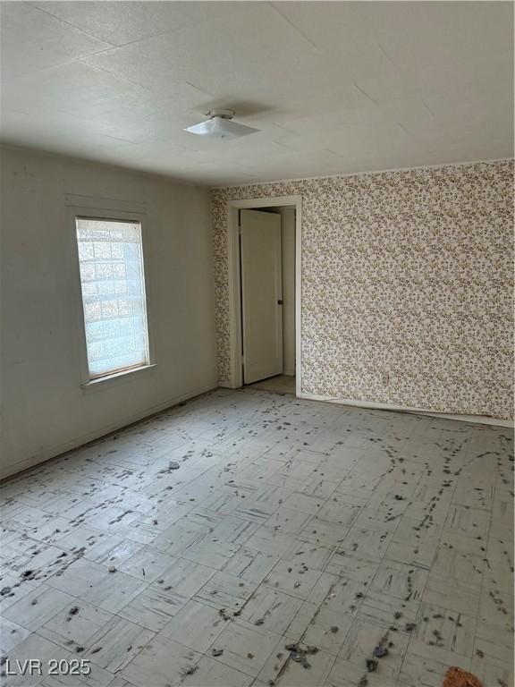 spare room featuring light floors