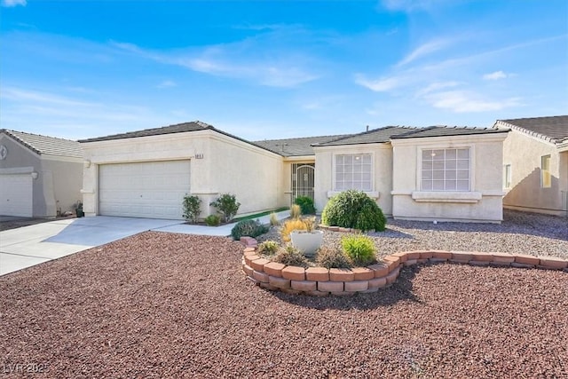 single story home with a garage, driveway, and stucco siding