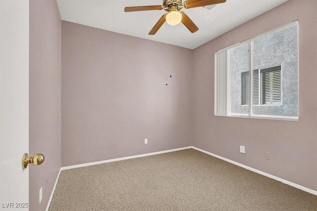 unfurnished room with ceiling fan, baseboards, and carpet floors