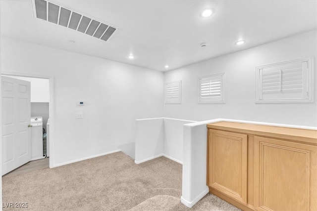 interior space with visible vents and washer and clothes dryer