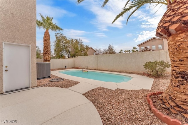 view of pool featuring central air condition unit, a fenced in pool, a fenced backyard, and a patio area