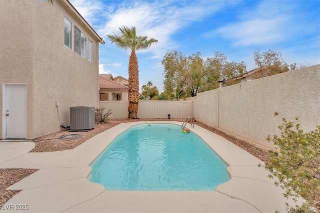 view of pool with central air condition unit, a fenced backyard, and a fenced in pool